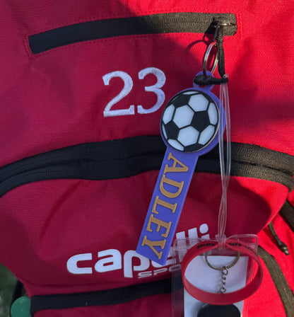 Example of custom soccer bag tag in purple and gold
