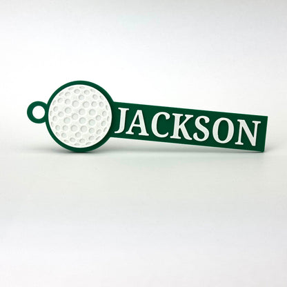 Example of custom sports bag tags with golf in green and white