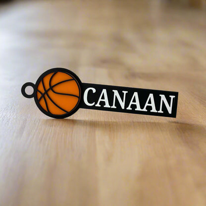 Personalized basketball bag tag in orange, black, and white