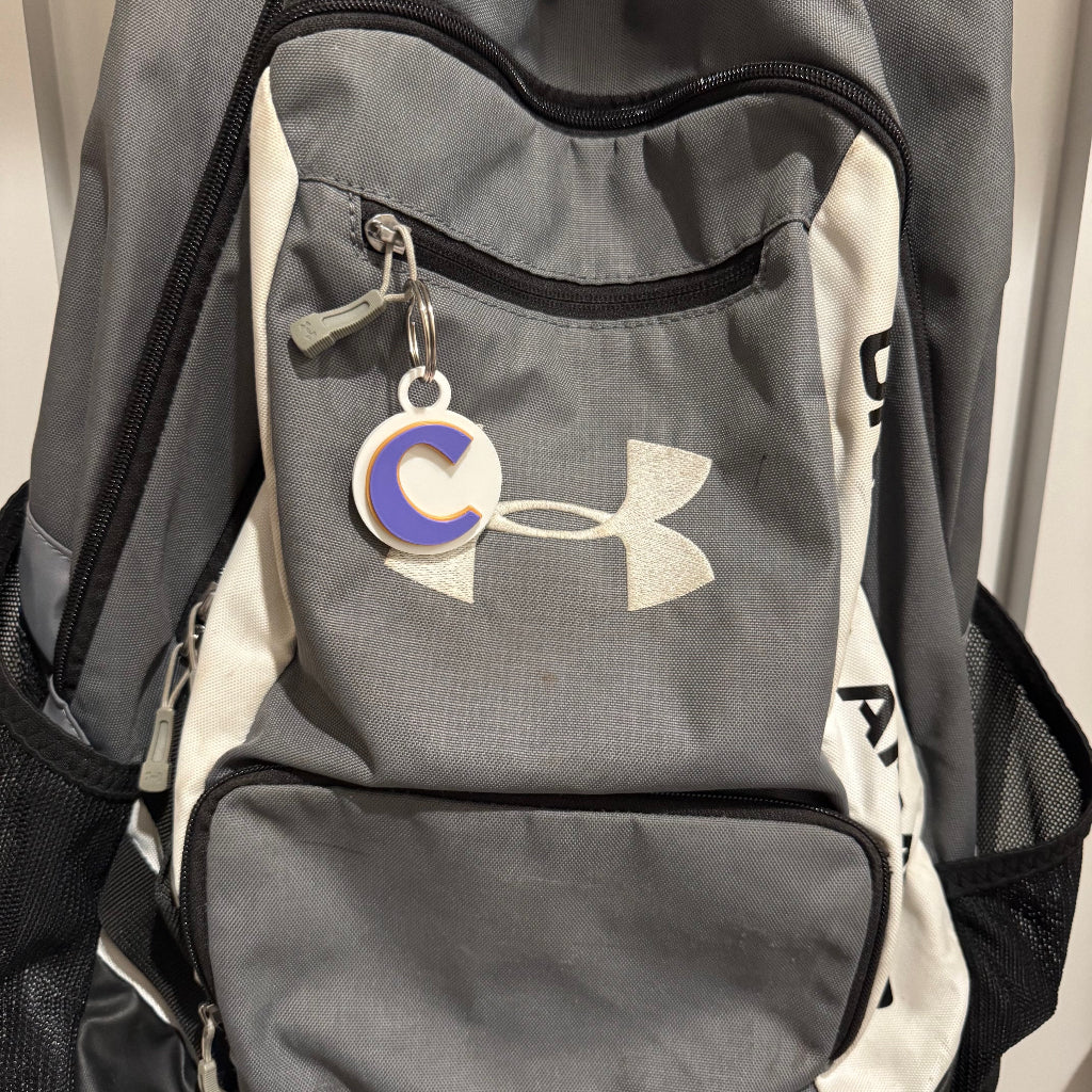 Cartersville Small Keychain on a backpack