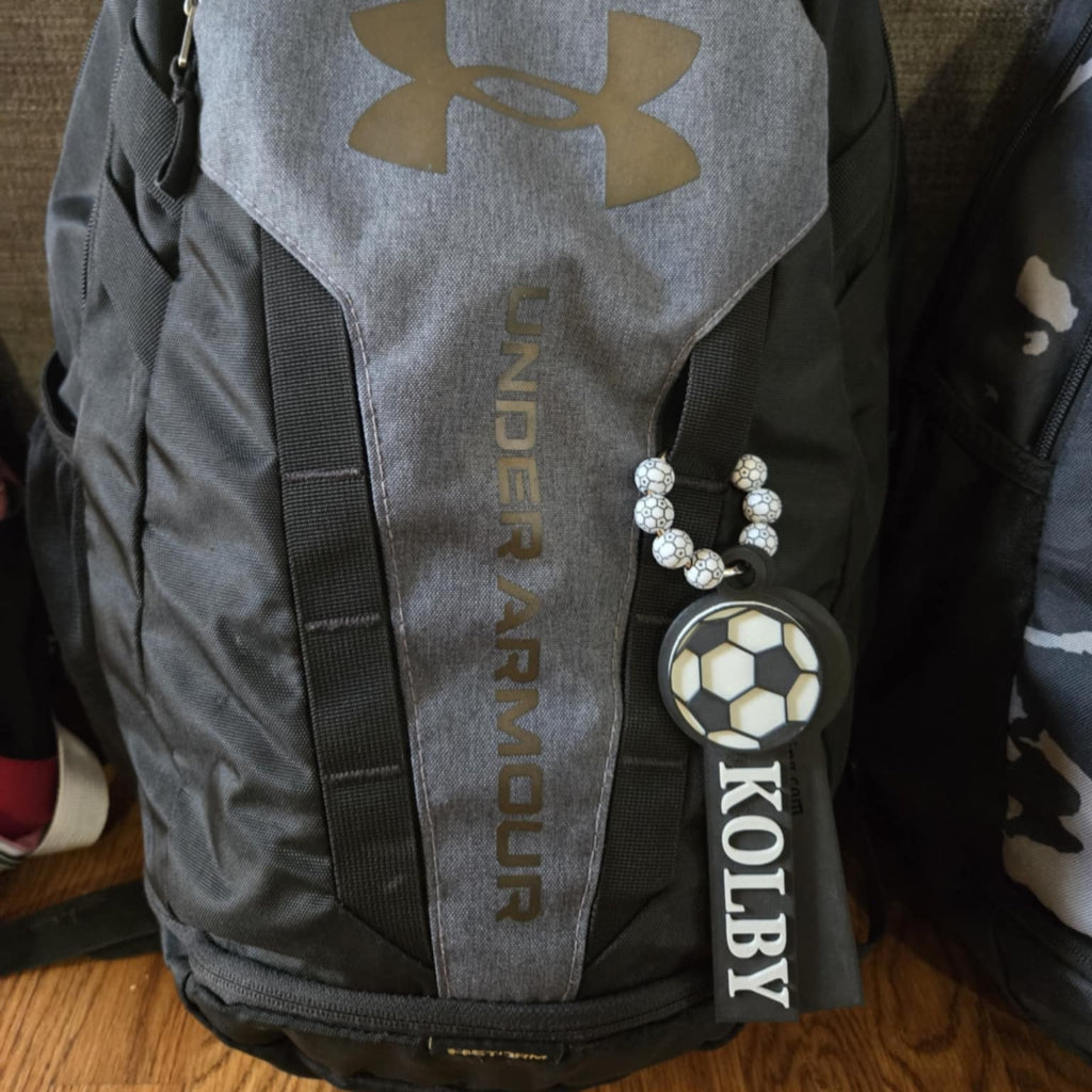 Example of custom soccer bag tag attached to a backpack